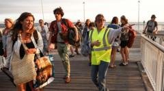 France orders evacuation of tourist spot as hundreds flee wildfires by boat