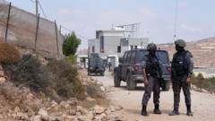 Activists try to deliver aid to Palestinians in homes besieged by Israeli settlers