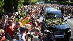 Thousands of Bonnie Tyler fans line the streets as coffin taken to Swansea home